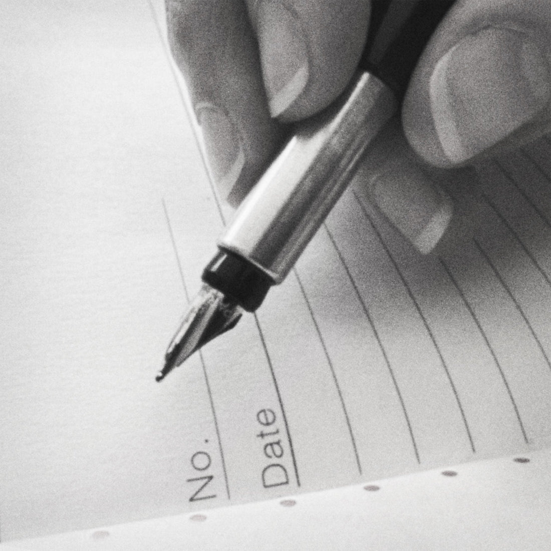 Grainy black-and-white close-up of a fountain pen hovering over the first lined page of an open notebook, the top two lines printed with "No." and "Date."
