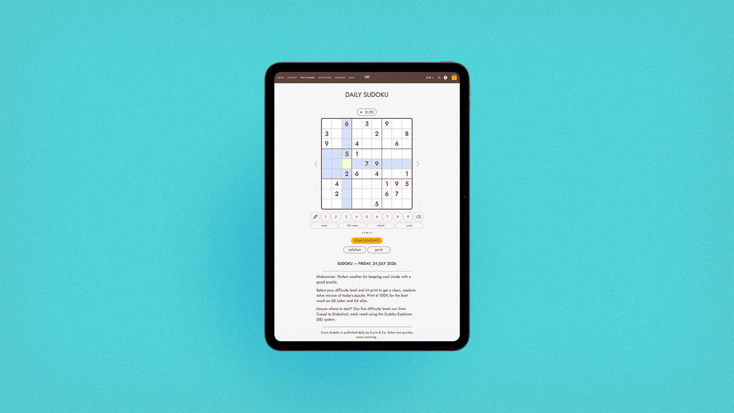 iPad tablet with screen on curioandco.com's interactive daily sudoku puzzle for Friday, July 24 2026. Photo on aqua background
